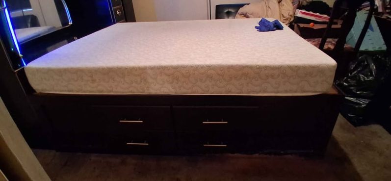 ...beautiful strong wood bed frame with 13 drawers and tons of storage under mattress. (excellent condition) $500 *Headboard not included Huge Storage Bed Frame